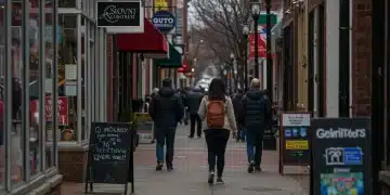 Bustling city street with people walking past local businesses, dynamic urban scene