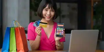 Smart shopper combining multiple discount codes on a smartphone for online purchases in 2025.